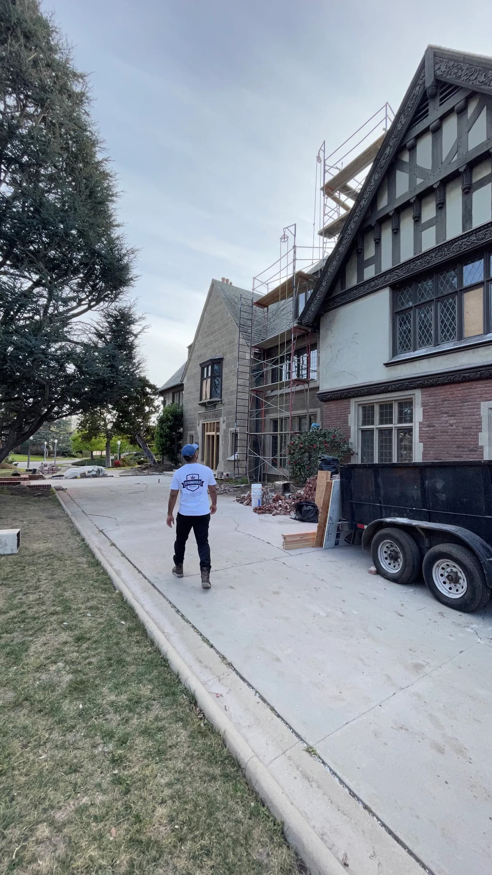 A Stronghold team member on the drive in front of the Tudor house.